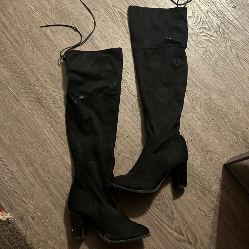 Cute knee high heel booties. Lace up in the back!